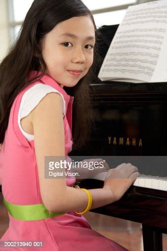 Girl Playing Piano Smiling Portrait High Res Stock Photo Getty Images