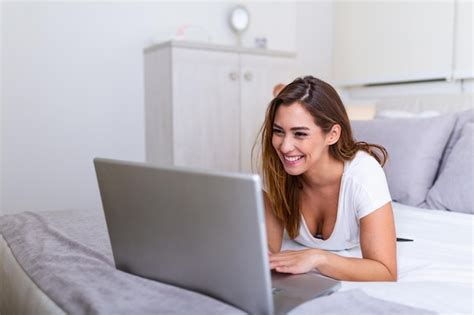 Premium Photo Beautiful Young College Student Doing Homework In Bed