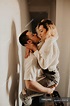 Passionate man and woman embracing and kissing at wall at home — young ...