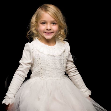 Portrait Of A Cute Little Girl On A Black Background Happy Chil Stock