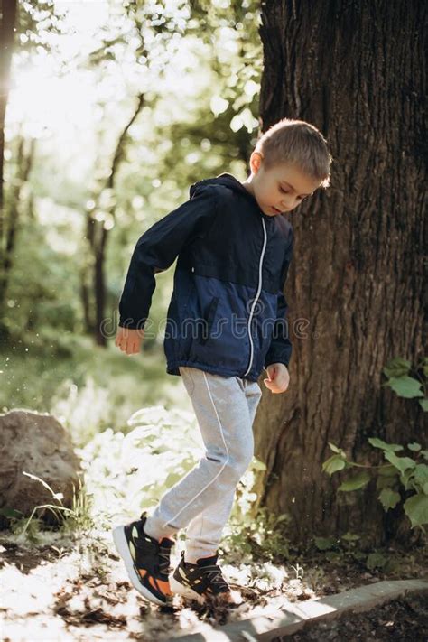 Walking Boy Child In The Park On A Sunny Spring Day Stock Photo Image