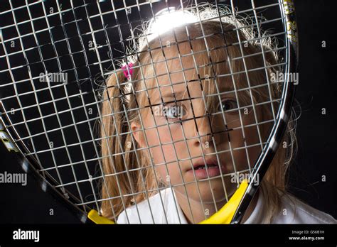 Humorous Portrait Of A Young Girl Playing Tennis Stock Photo Alamy