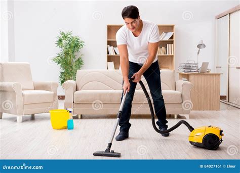 The Man Cleaning Home With Vacuum Cleaner Stock Image Image Of Dust