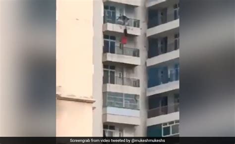 Video Man Holds On To Woman Hanging From Balcony She Falls Survives Flipboard