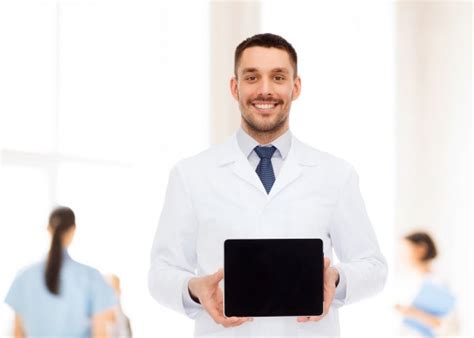 Smiling Male Doctor With Tablet Pc Stock Image Everypixel