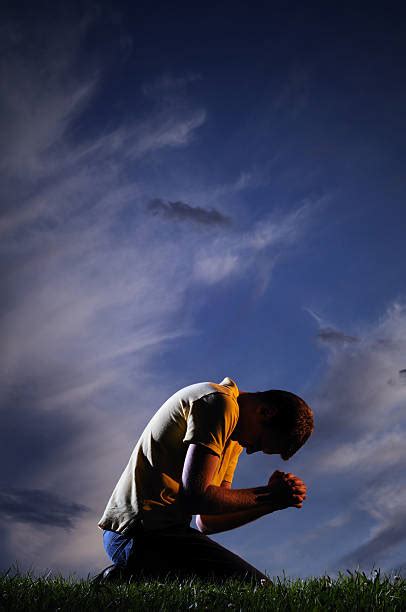 Man Praying On Knees Pictures Stock Photos Pictures And Royalty Free