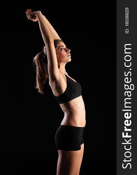 Woman In Sports Outfit Stretching Arms Above Head Free Stock Images Photos