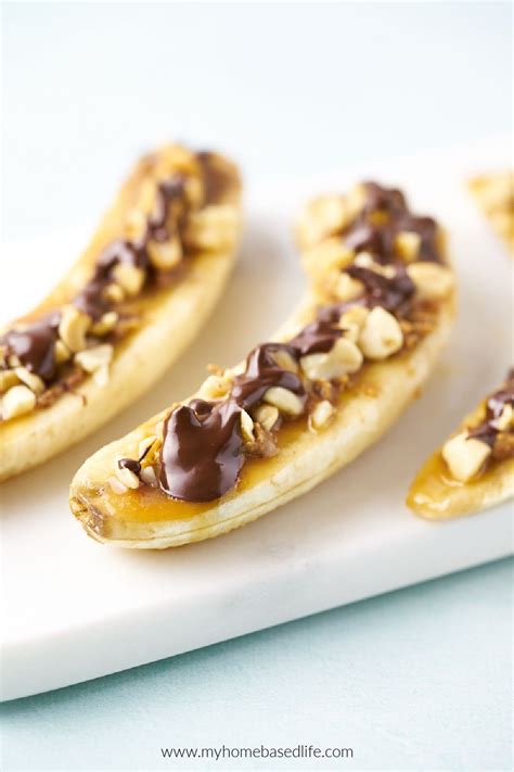 Then it gets topped with peanut butter. Snickers Banana Boats | My Home Based Life