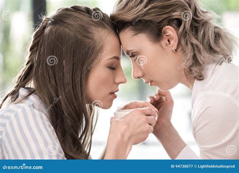 Sensual Girlfriends Drinking Coffee And Looking At Each Other Stock