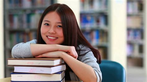 Videoblocks Happy Female Asian College Student In Librarysr4dgp7z