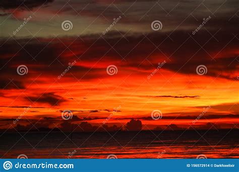 Sunset On Sea And Ocean Last Light Red Sky Silhouette Cloud Stock Photo
