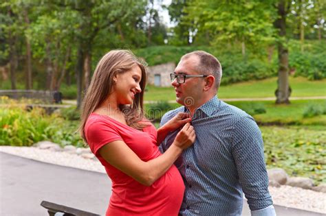 Pregnant Woman With Her Husband In Park Stock Image Image Of Father Nature 74827007