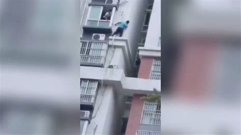 chinese men rescue girl trapped on 15th floor building ledge youtube