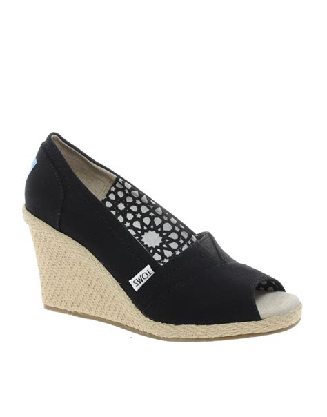 Toms Canvas Wedge Heeled Shoes In Black Lyst
