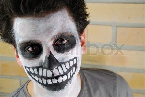 Portrait Of A Creepy Skeleton Guy Carnival Face Painting Stock Photo