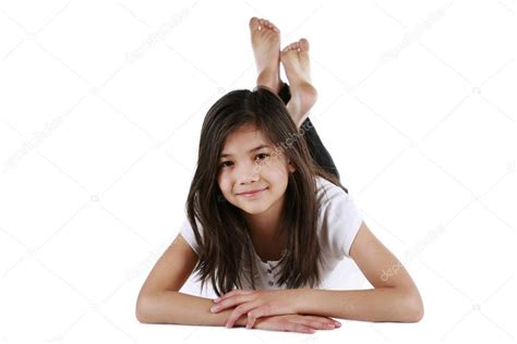 Beautiful Ten Year Old Biracial Girl Happily Relaxing On Floor Stock