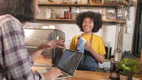 Two Baristas Partners Talk And Cheerful Smile At The Counter Bar Of Coffee Shop Stock Footage