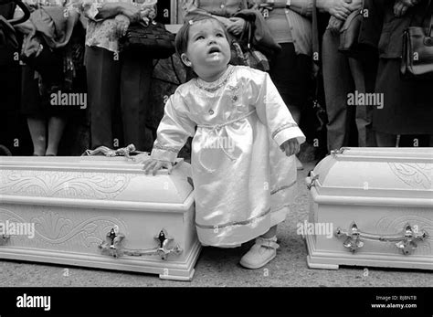Child Standing By Two Coffins Stock Photo Alamy