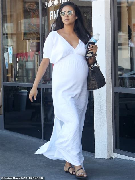 shay mitchell is an angelic mom to be as she dresses up her bump in flowing white maxi dress