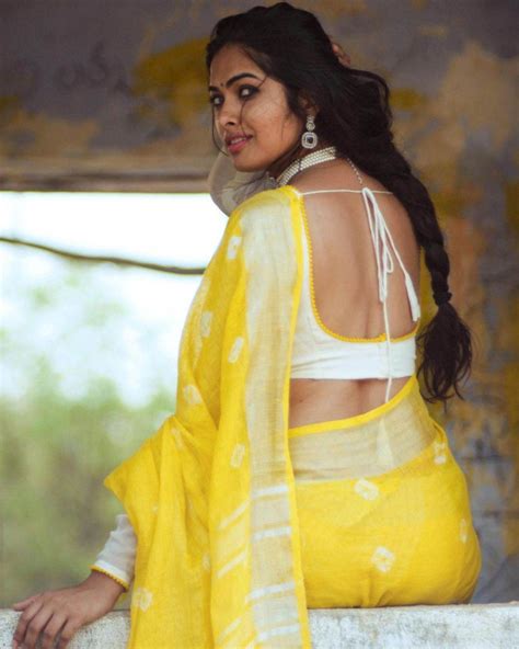 Divi Vadthya Posed For Photos In A Yellow Saree Telugu Swag