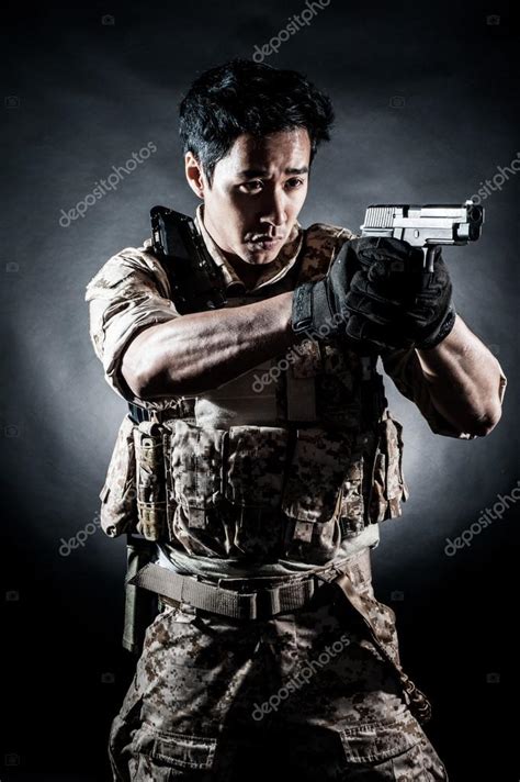 Soldier Man Hold Gun Fashion — Stock Photo © Maniaroom 38708749