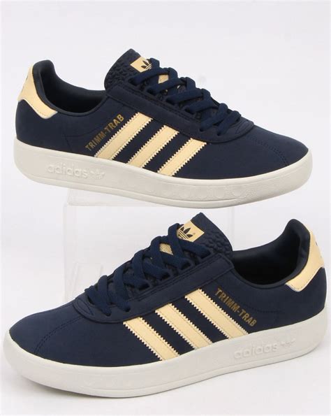Adidas is one of the most popular and important athletic footwear and apparel brands on earth, and a true authority of the sportswear industry, identified best by the brand's iconic three stripes logo. Adidas Trimm Trab Trainers Navy/Easy Yellow - 80s Casual Classics