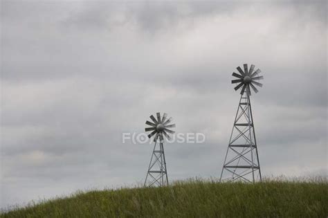 Two Windmills In Field — Clouds Farm Stock Photo 164930804