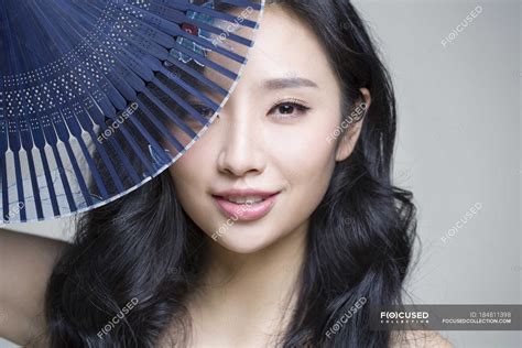 Chinese Woman Covering Face With Folding Fan — Sensuality Handheld Fan