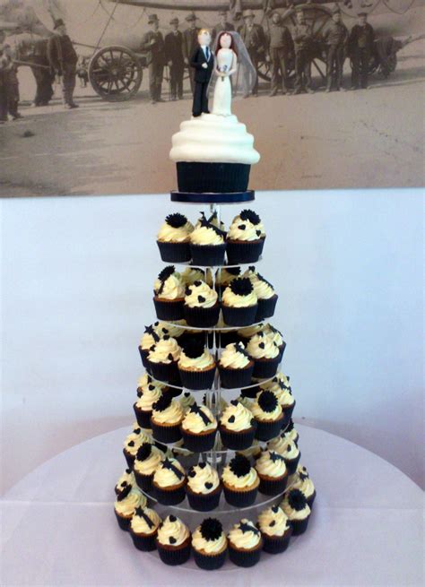 Wedding Cupcake Tower With Giant Cupcake And Bride And Groom Topper