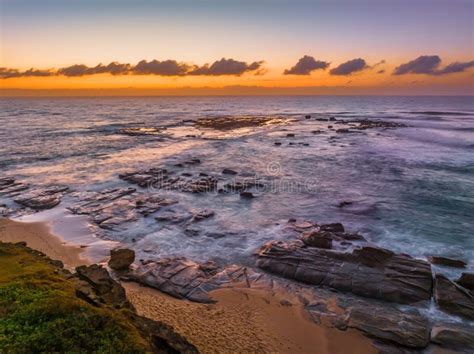 Aerial Sunrise Seascape With High Tide And Rock Platform Stock Photo