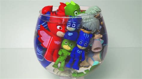 Pj Masks Toys In The Water Tank With Colorful Paints And Colorful Cups