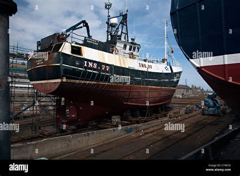 Fishing Boat Being Repaired In Peterhead In Scotland Stock Photo Alamy