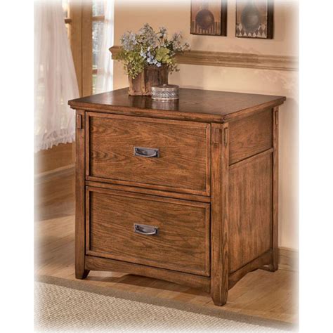 Add organization to your office with a filing cabinet. H319-42 Ashley Furniture Lateral File Cabinet