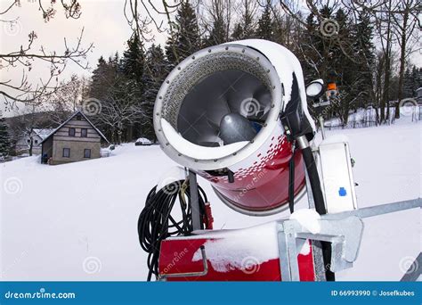 Snow Making Machine On Piste At Ski Resort In Snowy Country Stock Photo