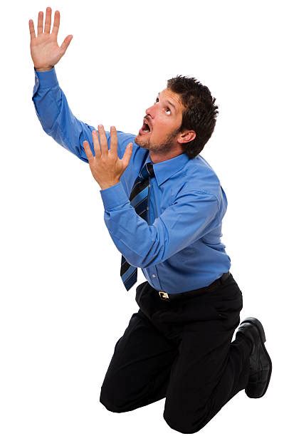 Man Praying On Knees Pictures Images And Stock Photos Istock