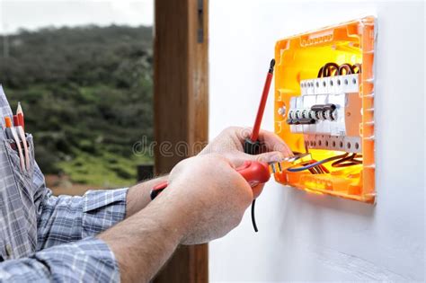 Electrician Technician Repairs The Electrical Panel Of A Residential