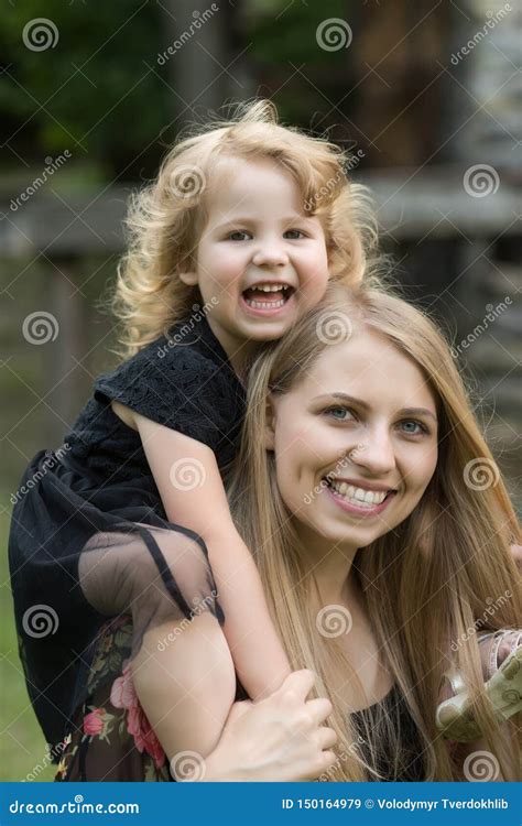 Daughter Sit On Mother Shoulders Stock Image Image Of Vacation Girl