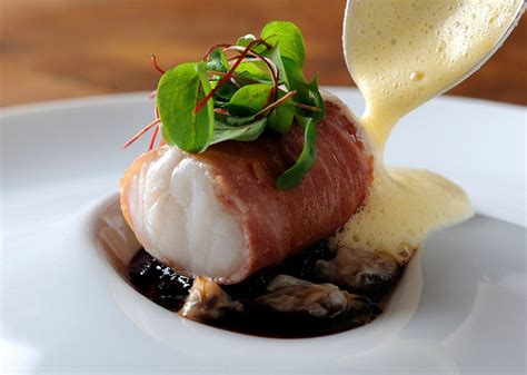Monkfish Wrapped In Parma Ham With Red Wine Jus Lemon Sabayon And