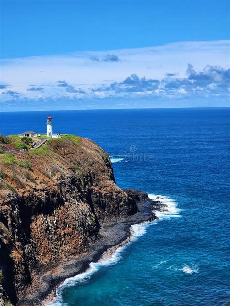 Aerial Shot Of The Kilauea Lighthouse On The Edge Of A Cliff Located In