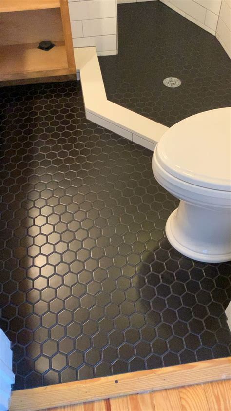 Tile floor penny tile hex tile floor creative tile black and white tiles patterned floor tiles flooring white hexagon tiles craftsman bathroom flooring can make a big statement, whether it's a large master bathroom or a small powder room. #hexagontile #blacktilebathroom #subway #blackshower # ...