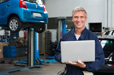 Car Repairman Using Laptop Stock Photo Free Download