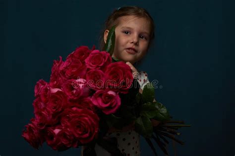 Cute Baby Girl With Bouquet Of Roses Flowers Stock Image Image Of