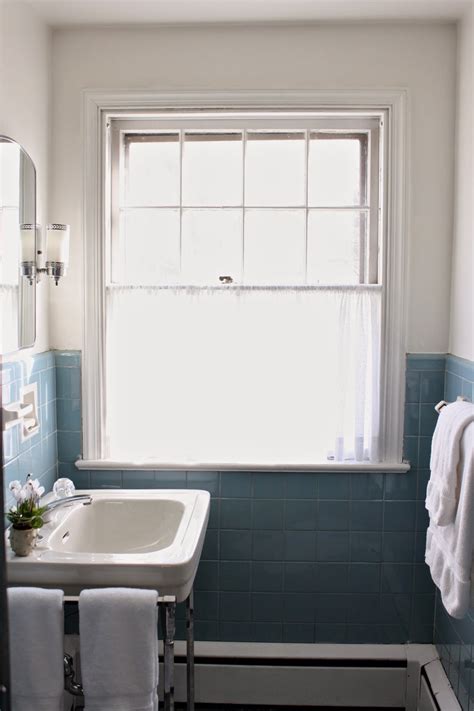 Small blue tiles are used for the flooring design of this traditional bathroom to give emphasis to the vintage look. Meet Me in Philadelphia: Pre-holiday Spruce-Up: The Vintage Blue Tile Bathroom