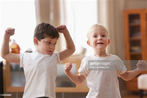 Caucasian Boys Flexing Muscles High Res Stock Photo Getty Images