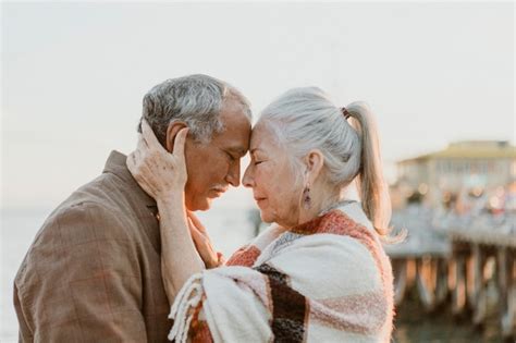 Premium Photo Romantic Senior Couple By The Pier