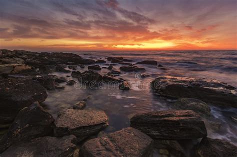 Sea Sunrise At The Rocky Beach Stock Image Image Of Dusk Orange