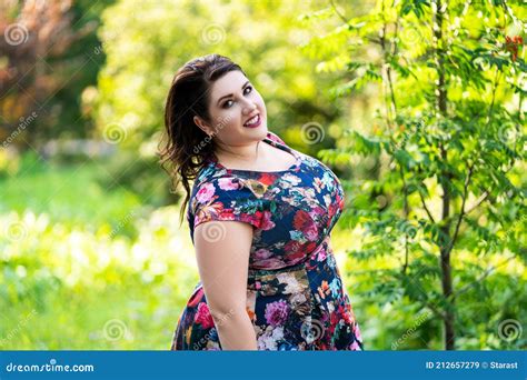 Happy Plus Size Model In Floral Dress Outdoors Beautiful Fat Woman In Nature Stock Image