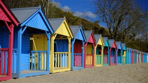 Colourful Beach Huts At Llanbedrog North Wales Beach Hut Hut Beach