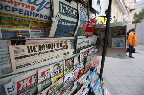 russia s putin signs law extending kremlin s grip over media the washington post