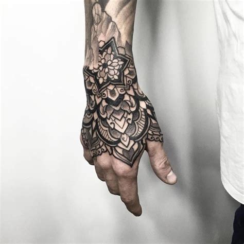 Black Ornamental Tattoo On The Right Hand Tribal Hand Tattoos Mandala